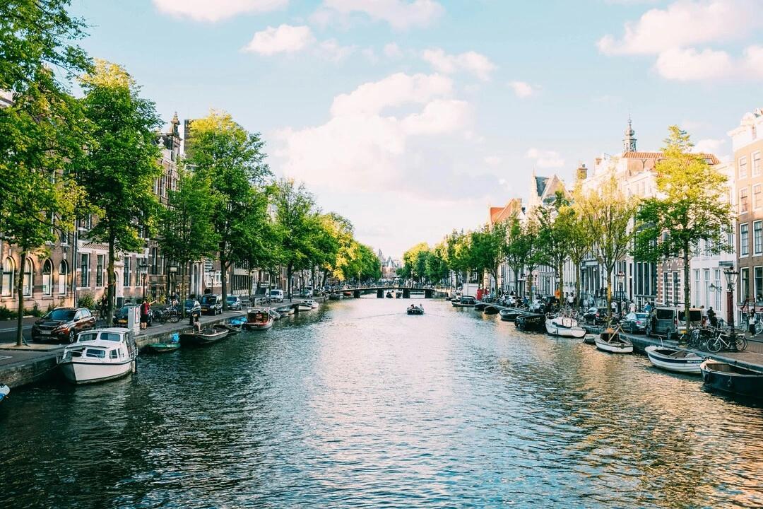 the canal in Amsterdam during a sunny day.